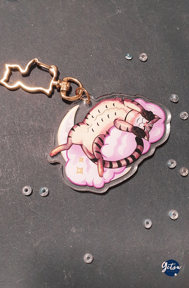 Porte-clef chat couché sur un nuage