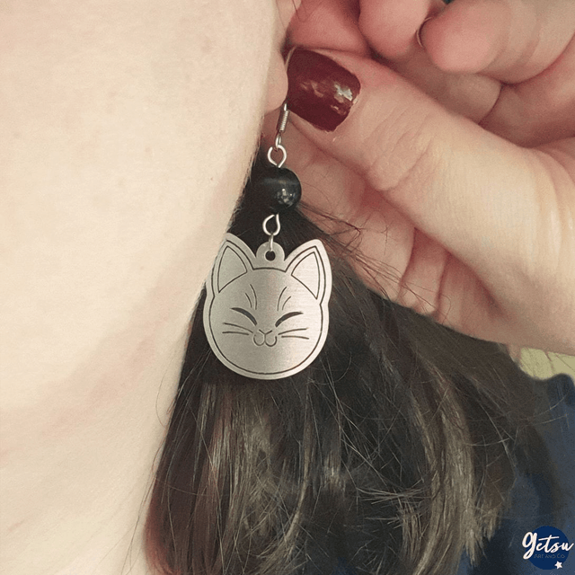 Boucles d'oreilles dépareillées Neko en acier inox et oeil de faucon