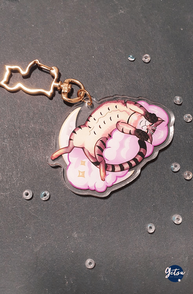 Porte-clef chat couché sur un nuage